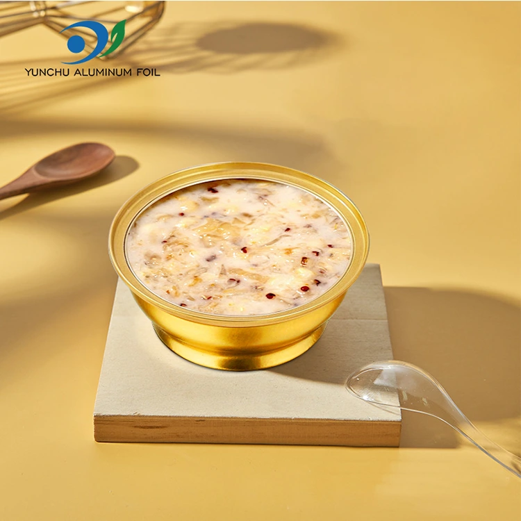 Jednorázové kulaté krabice s sebou malé zlaté mísy hliníkové fólie kontejnery
